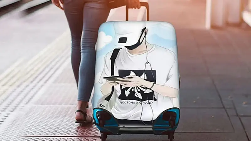 A woman carrying her luggage covered with a stylish cover