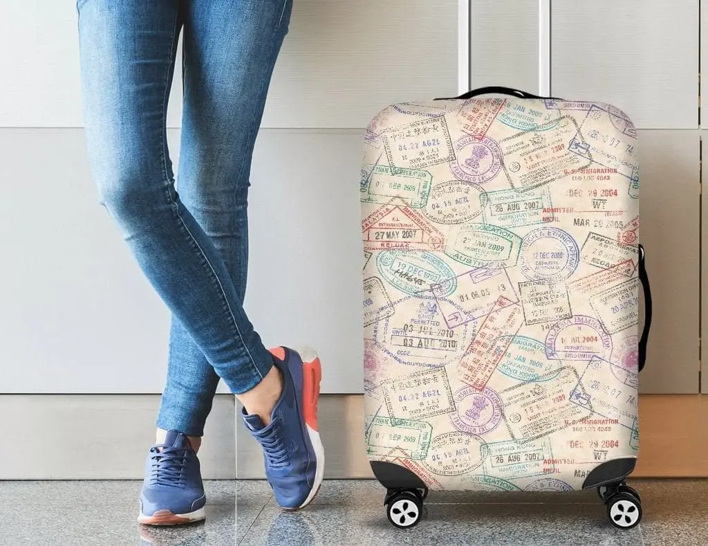 A man standing with his luggage covered with a stylish luggage cover for additional security